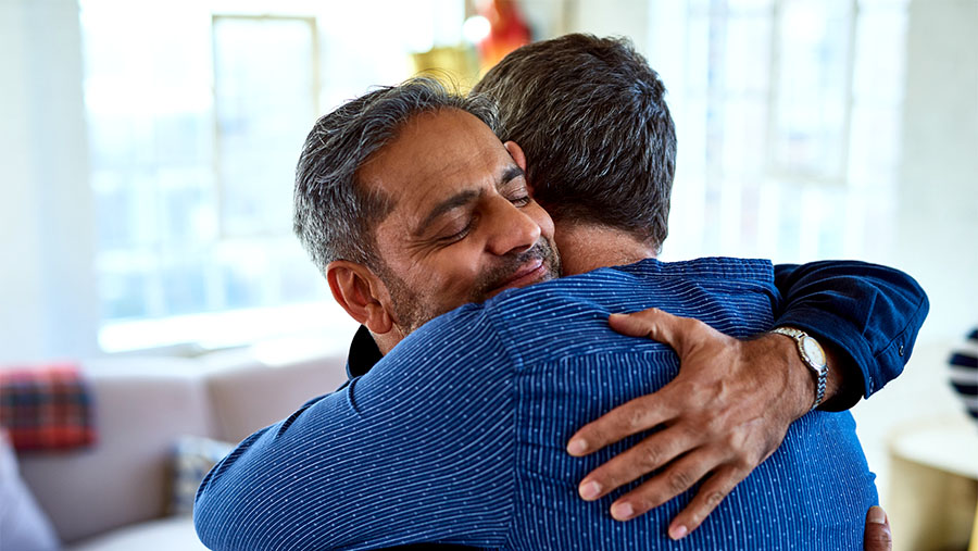 two people hugging in condolence